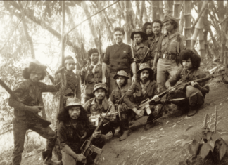Australian journalist Roger Domm with Falintil resistance fighters in Timor-Leste in 1990