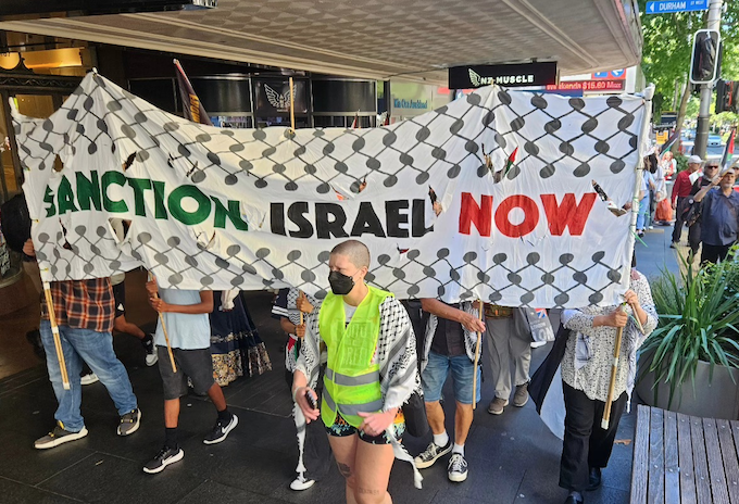 "Sanction Israel Now" declares a banner at today's Palestine rally and march in downtown Auckland