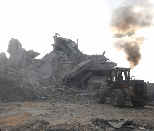 Palestinians clear rubble to search for survivors in a Gaza house
