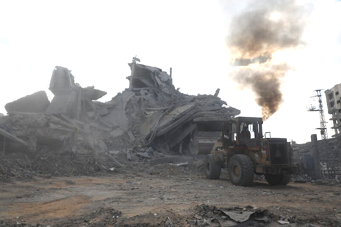 Searching for survivors APA 680wide Palestinians clear rubble to search for survivors in a Gaza house