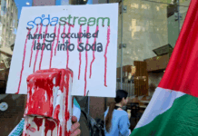 A SodaStream critical placard in today's protest