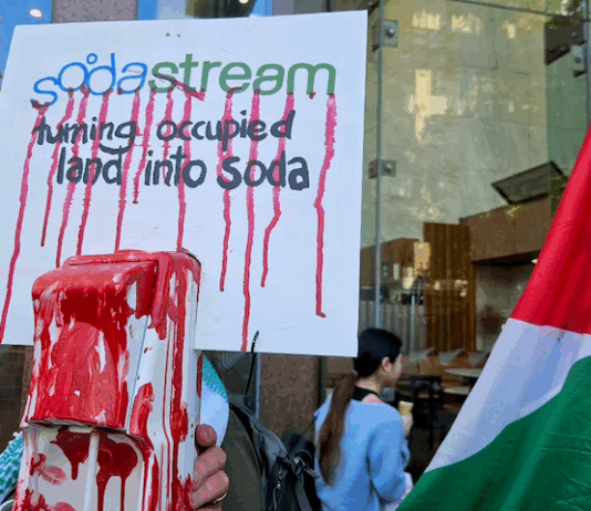 A SodaStream critical placard in today's protest