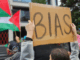 A pro-Palestinian protester outside the public broadcaster TVNZ in an Auckland demonstration