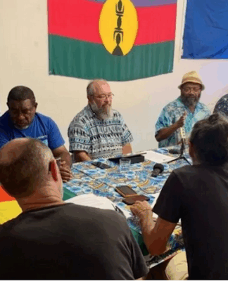 Pro-independence Progressist Union in Melanesia (UPM) leader Victor Tutugoro (centre with hat) and the party’s political bureau at a media conference this week in Nouméa
