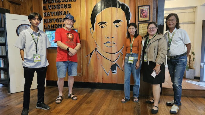 The author, Dr David Robie (red t-shirt) with acting curator Roniel Espina