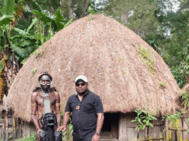 The author, Laurens Ikinia, with a well-preserved mummy from the Hubula tribe in Wamena