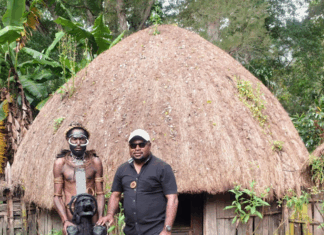 The author, Laurens Ikinia, with a well-preserved mummy from the Hubula tribe in Wamena