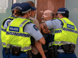 Former Wellington mayoral candidate Graham Bloxham being arrested by police at the Venezuela solidarity rally