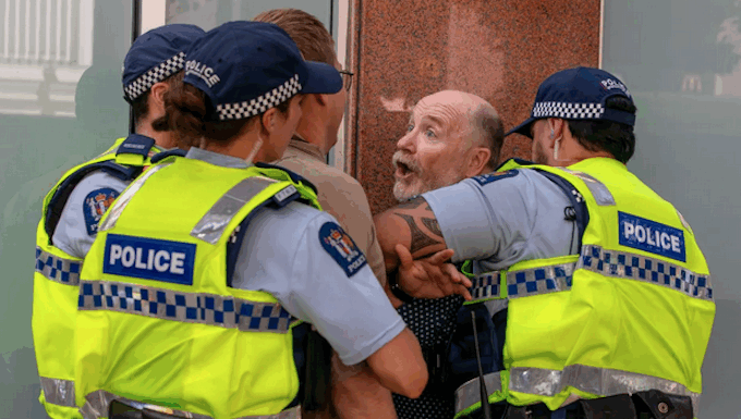 Former Wellington mayoral candidate Graham Bloxham being arrested by police at the Venezuela solidarity rally
