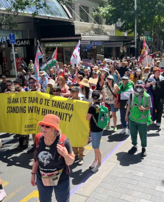 Two protests in Auckland’s CBD monitored by police with cordons, road closures The Toitū te Aroha diversity supporters march up Queen Street