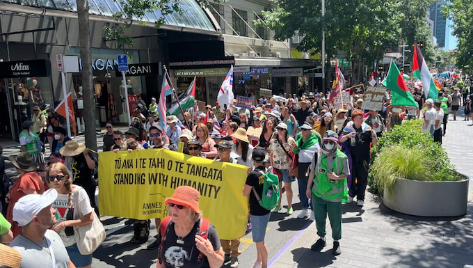 The Toitū te Aroha diversity supporters march up Queen Street