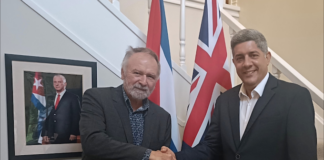 Cuban ambassador denounces US aggression and violations of international law Solidarity author Eugene Doyle with Cuban Ambassador Luis Ernesto Morejón Rodríguez