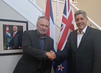 Cuban ambassador denounces US aggression and violations of international law Solidarity author Eugene Doyle with Cuban Ambassador Luis Ernesto Morejón Rodríguez