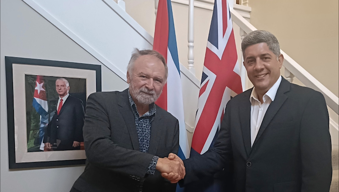 Cuban ambassador denounces US aggression and violations of international law Solidarity author Eugene Doyle with Cuban Ambassador Luis Ernesto Morejón Rodríguez