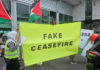 PSNA calls on NZ government to punish Kiwi soldiers taking part in Israeli genocide A "Fake Ceasefire" banner at an Auckland protest against the Gaza genocide