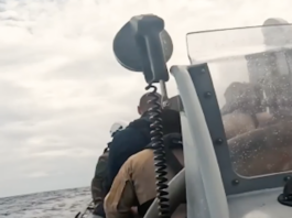 French sailors hunker down in an inflatable