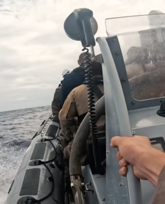 French sailors hunker down in an inflatable