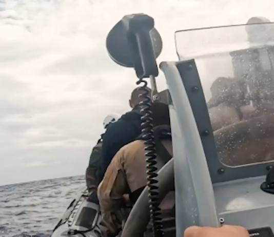 French sailors hunker down in an inflatable