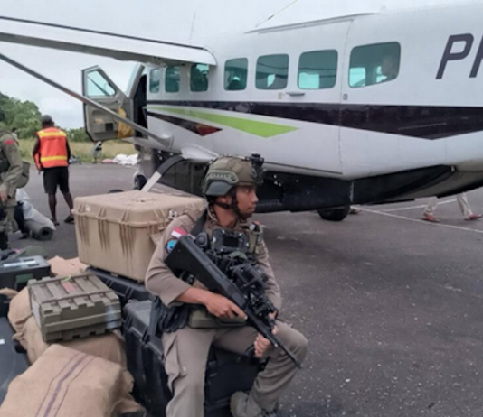 Indonesian soldiers and equipment next to a civilian aircraft in West Papua. Image: ULMWP