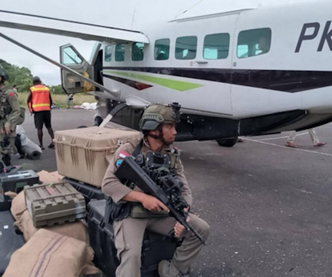Indon troops 1 ULMWP 680wide Indonesian soldiers and equipment next to a civilian aircraft in West Papua. Image: ULMWP