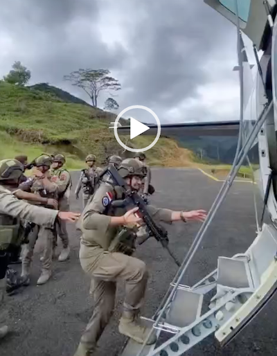 Indonesian troops boarding a civilian aircraft in West Papua