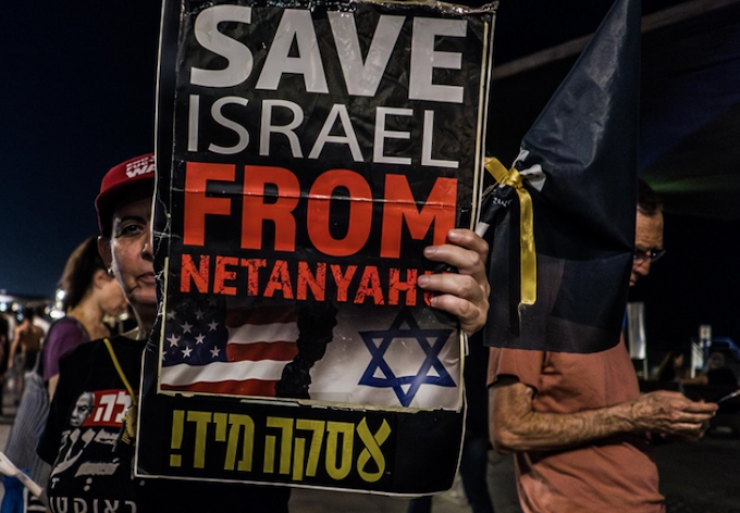 Israel could collapse before its centennial, warns retired Israeli general An anti-Netanyahu placard at an Israeli rally