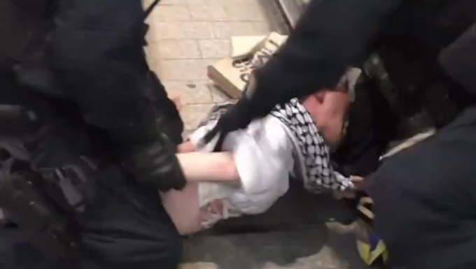 Amnesty calls for independent probe of ‘shocking’ Australian police violence against peaceful protesters A scene of NSW police brutality raining blows on a young man in a keffiyeh in Sydney