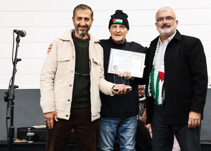 The Palestinian community presenting Roger Fowler an award