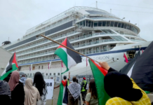 Gaza and Rocket Lab protesters on Auckland Tāmaki Makaurau's Queens Wharf