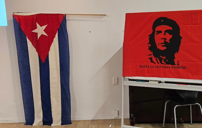 The Cuban flag and an iconic image of Ernesto "Che" Guevara, an Argentine Marxist revolutionary and guerrilla leader