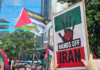 A "Hands Off Iran" placard at the Auckland rally