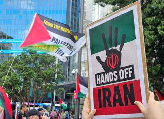 A "Hands Off Iran" placard at the Auckland rally