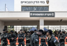 Far-right Israelis and relatives of the soldiers gather in front of a military court building and stage a protest