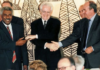 Then French prime minister Lionel Jospin (centre) shakes hands