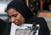 A mourner attends the funeral of child killed in a strike on a primary school in Minab, Hormozgan province, at the start of the US-Israel war on Iran