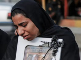 A mourner attends the funeral of child killed in a strike on a primary school in Minab, Hormozgan province, at the start of the US-Israel war on Iran