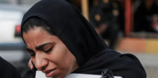 A mourner attends the funeral of child killed in a strike on a primary school in Minab, Hormozgan province, at the start of the US-Israel war on Iran