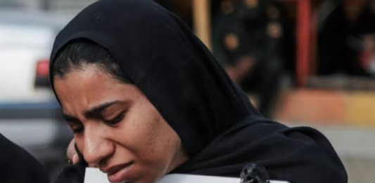 A mourner attends the funeral of child killed in a strike on a primary school in Minab, Hormozgan province, at the start of the US-Israel war on Iran
