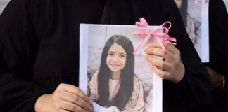 Alternative Jewish Voices: Stop this Iran catastrophe! A mourner holds up a picture of one of the victims of the US-Israeli attack on Iran at Minab
