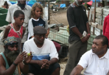 Shattered homes . . . community leaders at Port Moresby's Paga Hill settlement