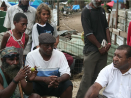 Shattered homes . . . community leaders at Port Moresby's Paga Hill settlement