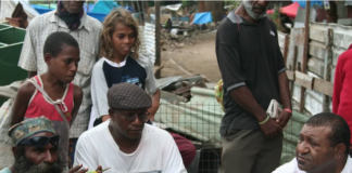 Shattered homes . . . community leaders at Port Moresby's Paga Hill settlement