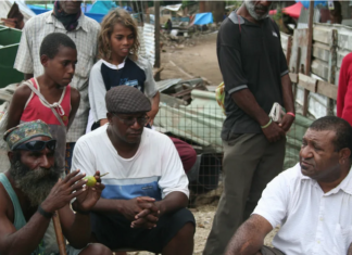 Shattered homes . . . community leaders at Port Moresby's Paga Hill settlement