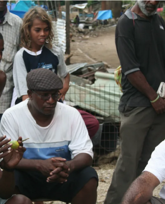 Shattered homes . . . community leaders at Port Moresby's Paga Hill settlement