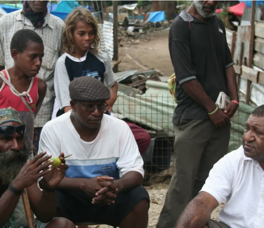 Shattered homes . . . community leaders at Port Moresby's Paga Hill settlement