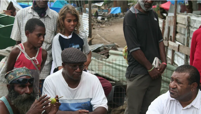 Shattered homes . . . community leaders at Port Moresby's Paga Hill settlement