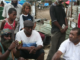 Shattered homes . . . community leaders at Port Moresby's Paga Hill settlement