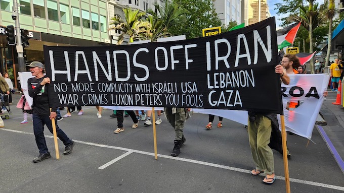 A "Hands off Iran" banner at Auckland's "Stop Wars Aotearoa" rally and march