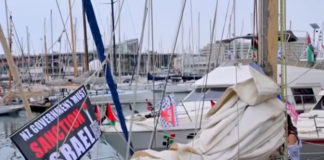 Global Sumud Flotilla heads from Barcelona to break Gaza blockade A "New Zealand government must sanction Israel" banner flutters on one of the Global Sumud Flotilla boats