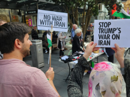 Protesters at a New Zealand rally against the US-Israel war on Iran and the Israeli genocide in Gaza